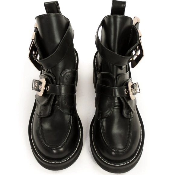 Black boot with gold-toned buckles. - Picture 2 of 3